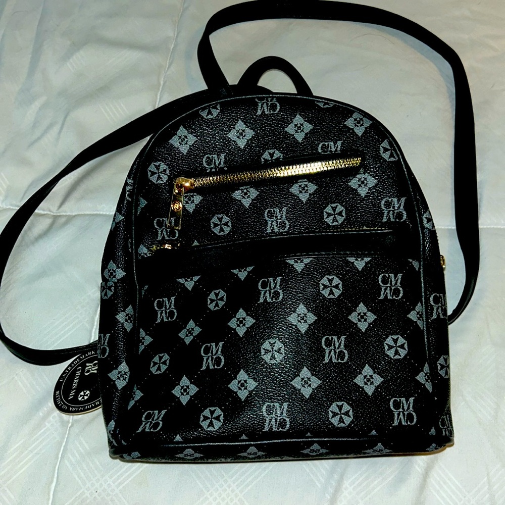 A cute black and grey stylish charisma mini bag you can take wherever you go!!